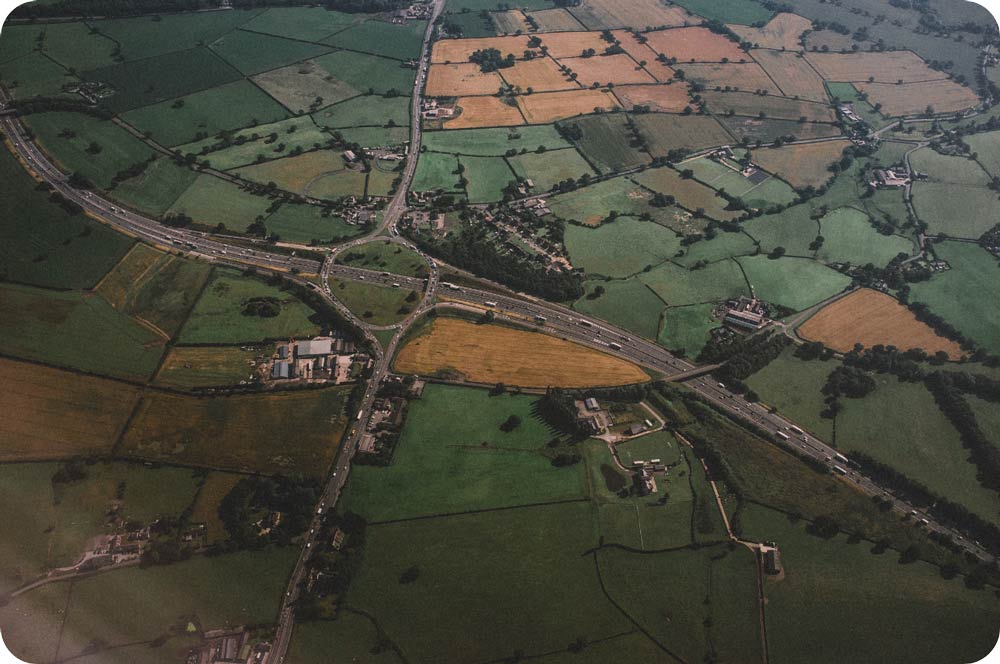 aerial-view-of-a-roundabout-with-farm-fields