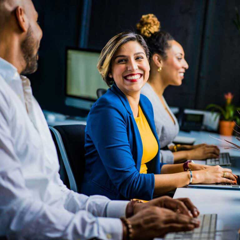 A work team, working in a relaxed atmosphere